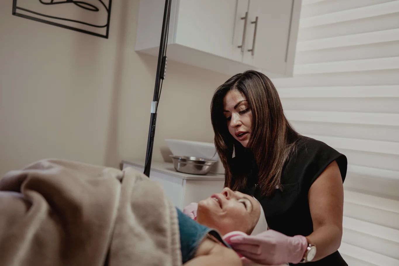 GoWell skin specialist treating a client with microneedling in Coral Springs