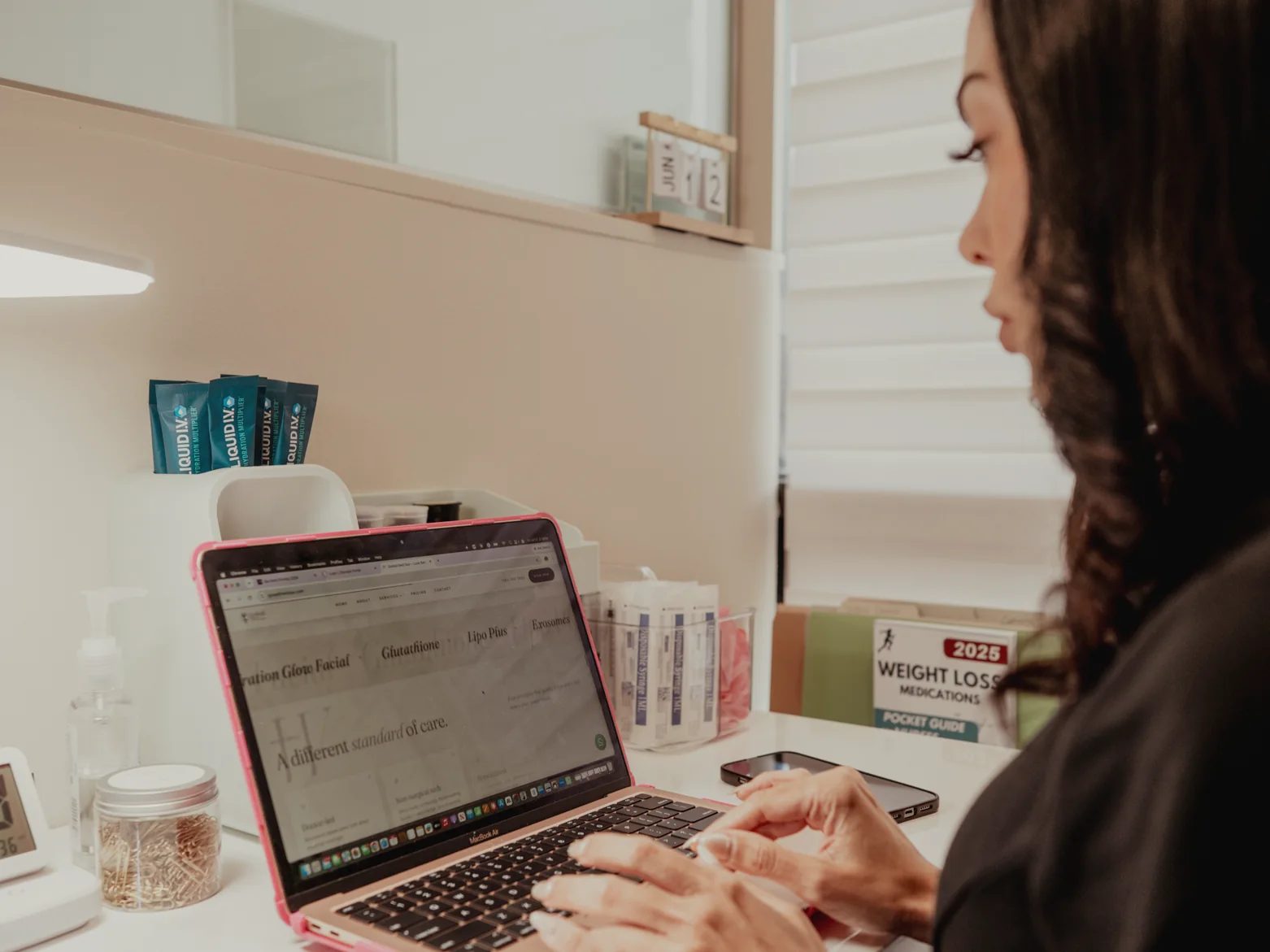 A GoWell wellness nurse reviewing a client's measurements at the Coral Springs office